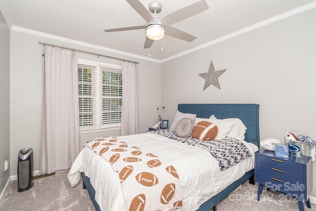 carpeted bedroom featuring crown molding and ceiling fan