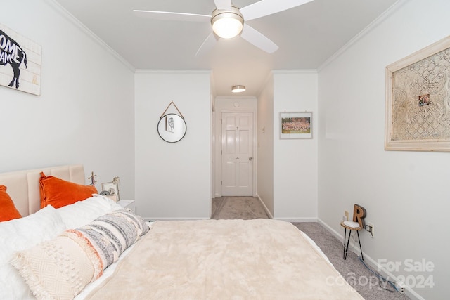 carpeted bedroom with crown molding and ceiling fan