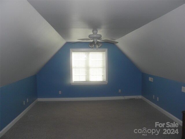 204 Par Dr, Henderson, NC 27536 - additional living space with a ceiling fan, lofted ceiling, carpet flooring, and baseboards