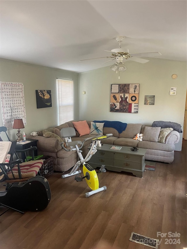 living room featuring hardwood / wood-style flooring and ceiling fan