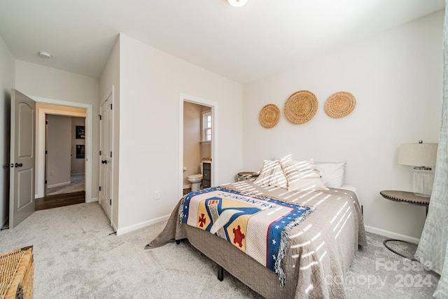 carpeted bedroom with connected bathroom