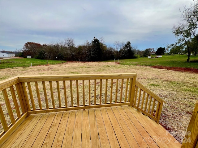 deck featuring a lawn