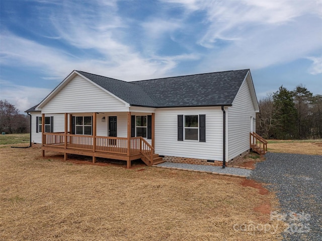 view of front of property with crawl space, a porch, a front lawn, and roof with shingles