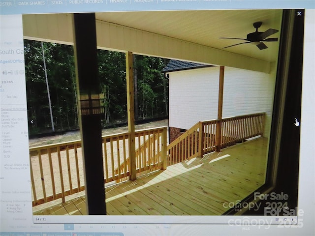 wooden terrace with a ceiling fan