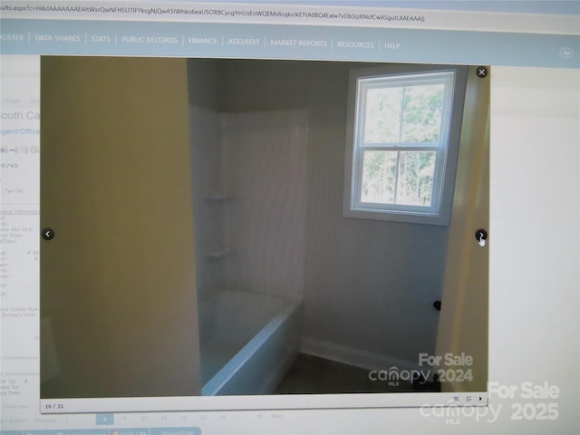 bathroom featuring a washtub