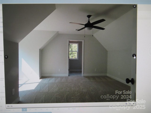 additional living space featuring lofted ceiling, ceiling fan, baseboards, and carpet flooring