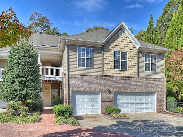 view of front of house with a balcony and a garage