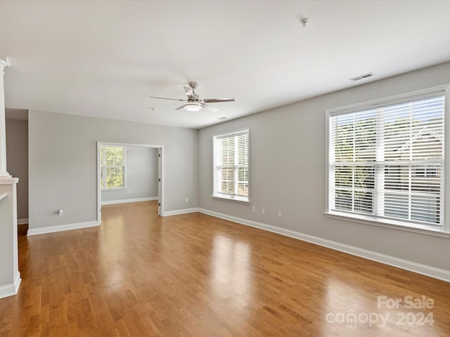 spare room with light hardwood / wood-style floors and ceiling fan