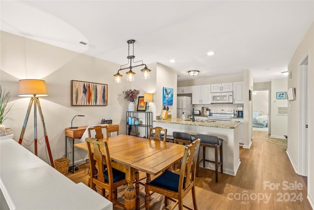 dining room featuring light hardwood / wood-style flooring