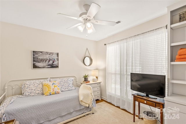 bedroom featuring ceiling fan and light hardwood / wood-style flooring