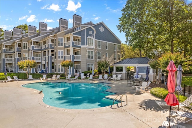 view of pool featuring a gazebo and a patio area