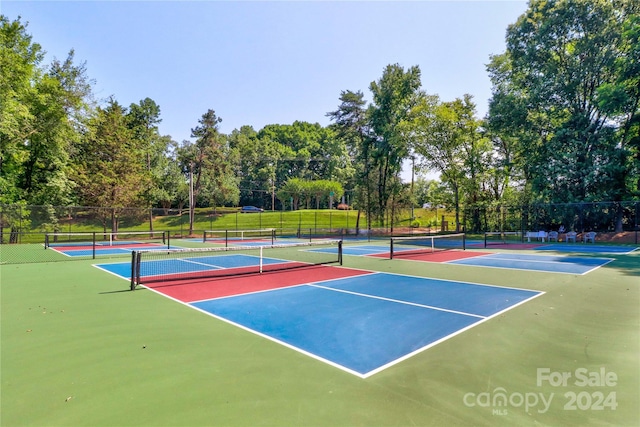 view of sport court featuring basketball hoop