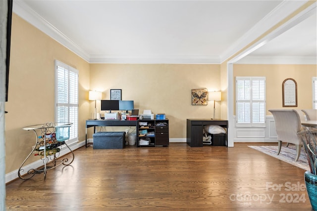 office with dark hardwood / wood-style flooring, a healthy amount of sunlight, and crown molding