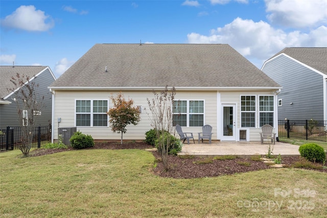 back of house featuring a patio, central AC unit, roof with shingles, a yard, and fence private yard