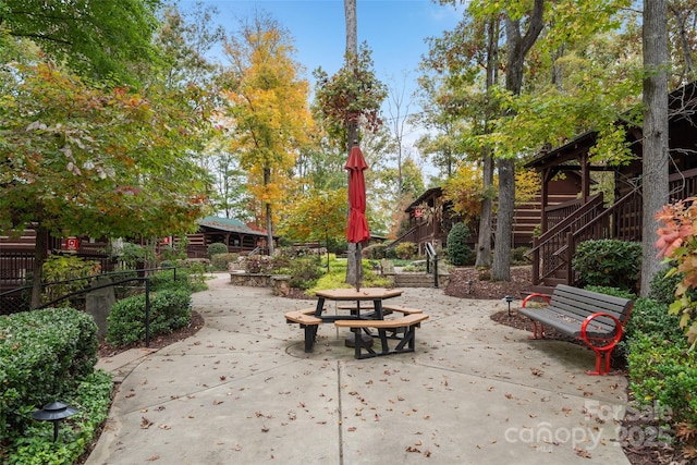 view of patio / terrace with stairway and outdoor dining area