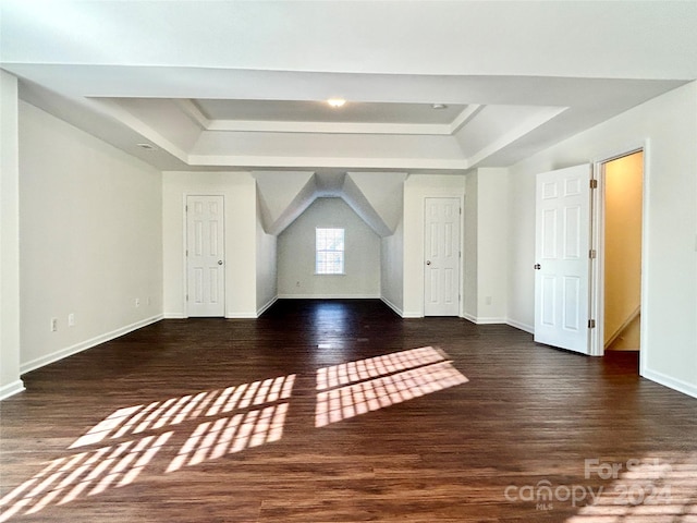 bonus room with dark hardwood / wood-style flooring