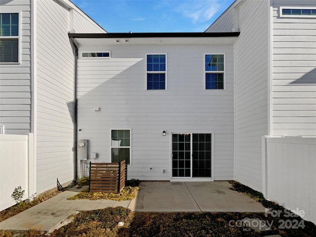 back of house with a patio area