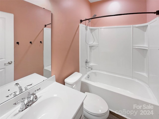 full bathroom featuring vanity, toilet, and  shower combination