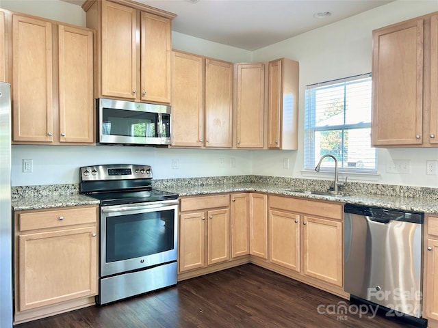 kitchen featuring light brown cabinets, sink, dark hardwood / wood-style floors, and appliances with stainless steel finishes