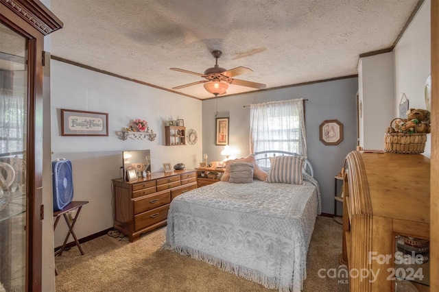 carpeted bedroom featuring crown molding, a textured ceiling, and ceiling fan