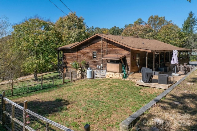 rear view of property with a patio area and a yard