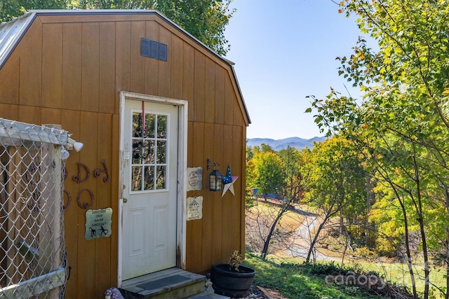 view of outbuilding featuring a mountain view