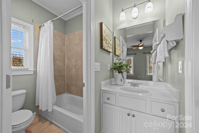 full bathroom featuring vanity, toilet, shower / bath combo with shower curtain, and a wealth of natural light