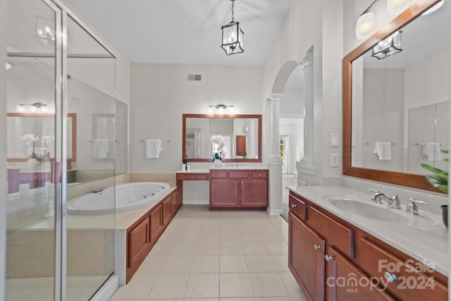 bathroom featuring an inviting chandelier, ornate columns, vanity, plus walk in shower, and tile patterned flooring