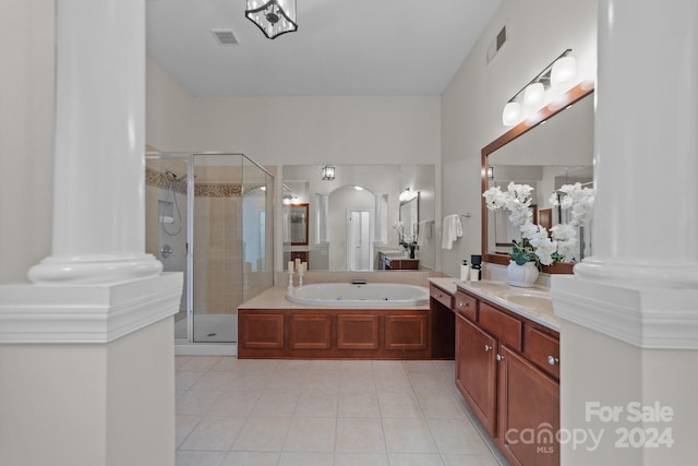 bathroom featuring vanity, plus walk in shower, ornate columns, and tile patterned floors