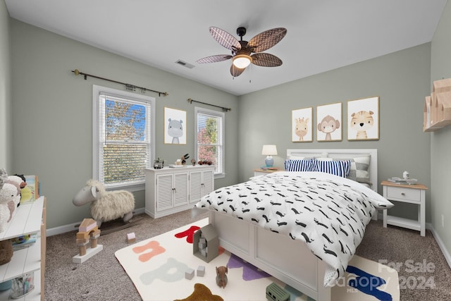 carpeted bedroom with ceiling fan