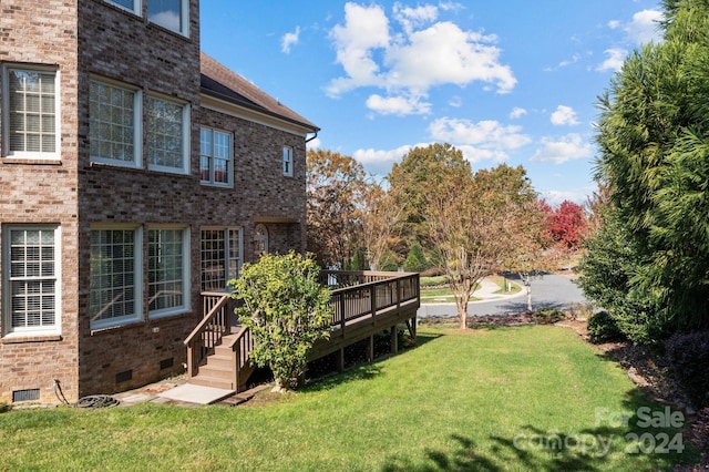 view of yard featuring a wooden deck