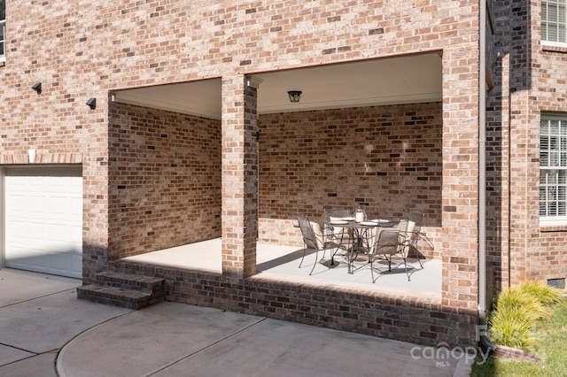 view of patio with a garage