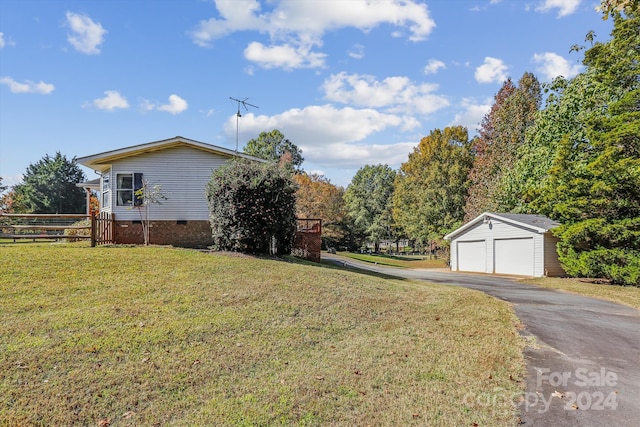 view of side of home with an outdoor structure, a lawn, and a garage