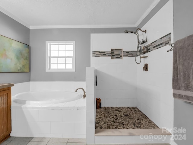 bathroom featuring tile patterned flooring, separate shower and tub, crown molding, vanity, and a textured ceiling