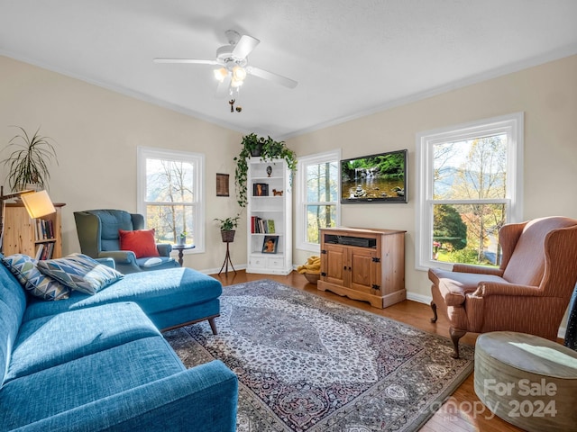 living room featuring a wealth of natural light, hardwood / wood-style flooring, and ceiling fan