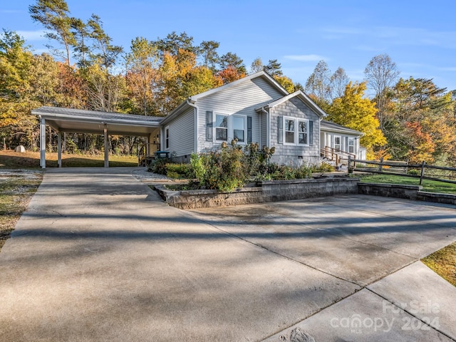 view of side of home featuring a carport