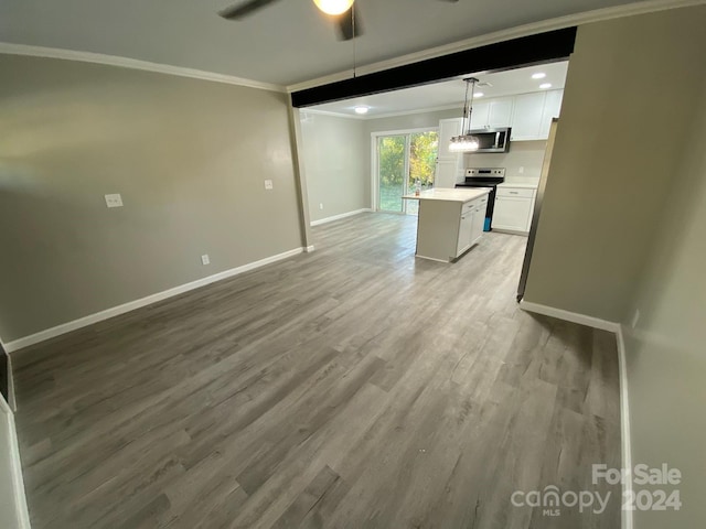 unfurnished living room with crown molding, light hardwood / wood-style flooring, and ceiling fan