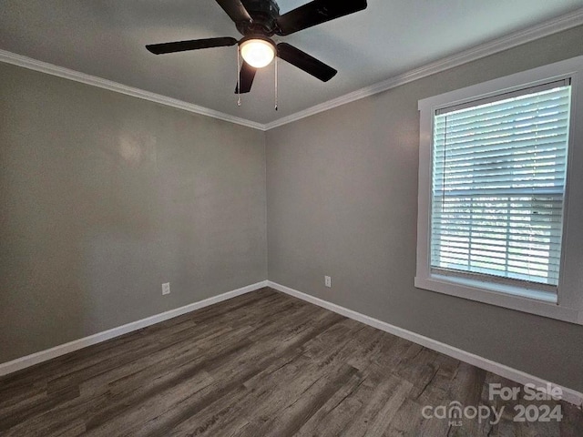 empty room with crown molding, dark hardwood / wood-style floors, and ceiling fan