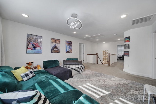 carpeted home theater room with baseboards, visible vents, and recessed lighting