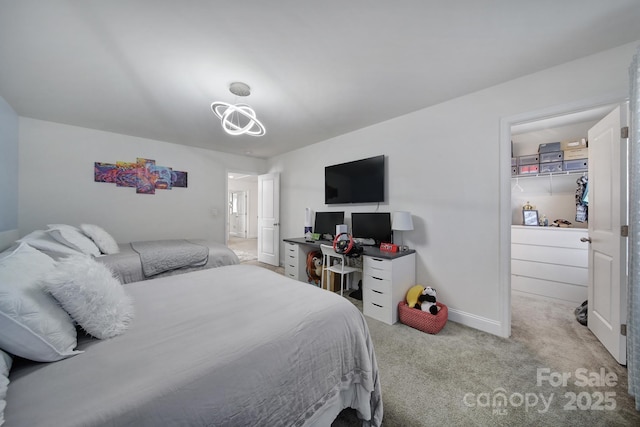 bedroom with baseboards, carpet, and an inviting chandelier