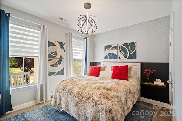 535 Red Wolf Ln, Lake Wylie, SC 29710 - carpeted bedroom featuring a chandelier and baseboards