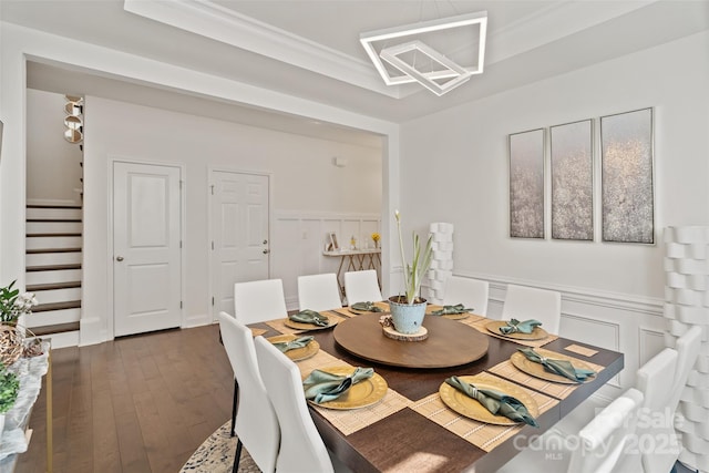 535 Red Wolf Ln, Lake Wylie, SC 29710 - dining area featuring stairway, wainscoting, dark wood finished floors, crown molding, and a decorative wall