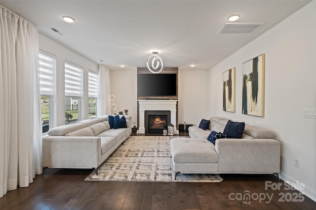 535 Red Wolf Ln, Lake Wylie, SC 29710 - living room featuring a lit fireplace, dark wood-type flooring, and recessed lighting