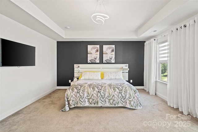535 Red Wolf Ln, Lake Wylie, SC 29710 - carpeted bedroom with a tray ceiling and baseboards