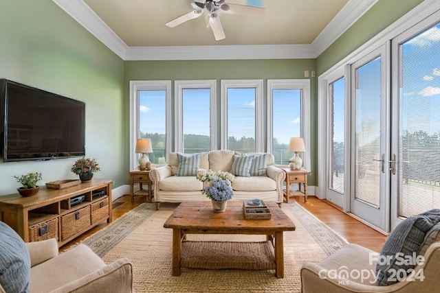 sunroom / solarium featuring ceiling fan and a wealth of natural light