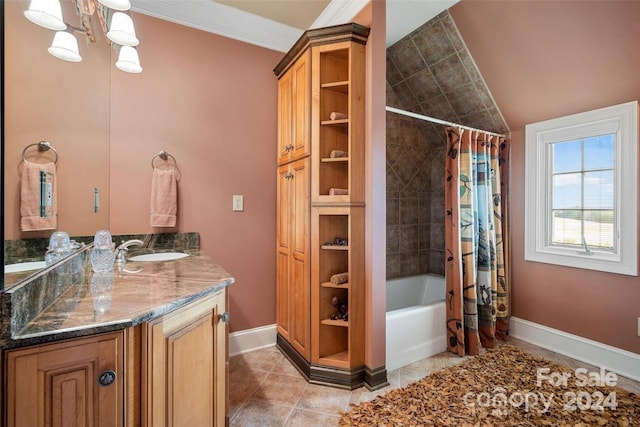 bathroom with vaulted ceiling, shower / bath combo with shower curtain, vanity, crown molding, and tile patterned flooring