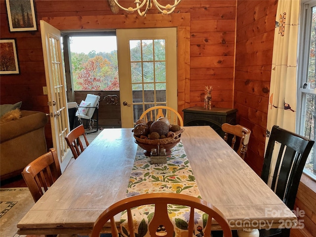 dining room with wooden walls