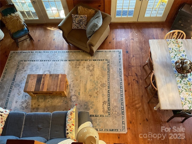 living room featuring dark hardwood / wood-style floors and french doors