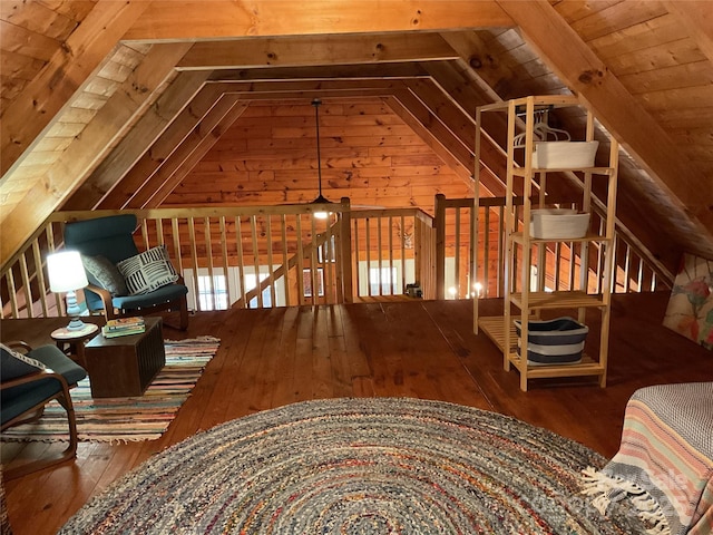 interior space featuring lofted ceiling and hardwood / wood-style floors