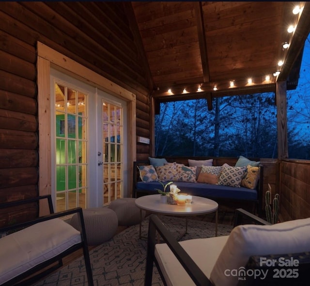 view of patio / terrace with french doors and an outdoor living space